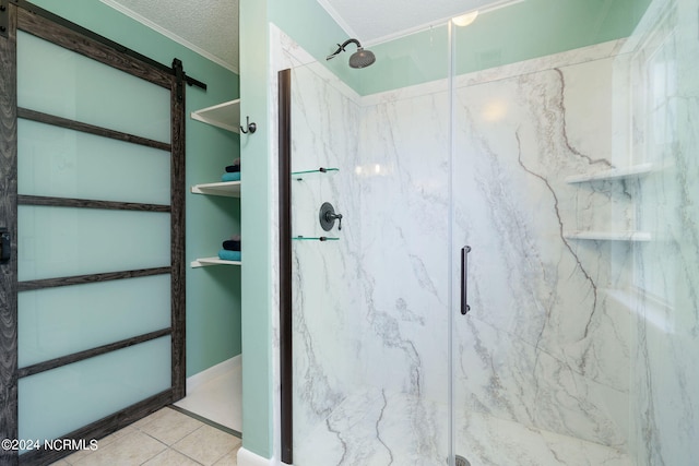 bathroom featuring a shower with door, a textured ceiling, and tile patterned flooring