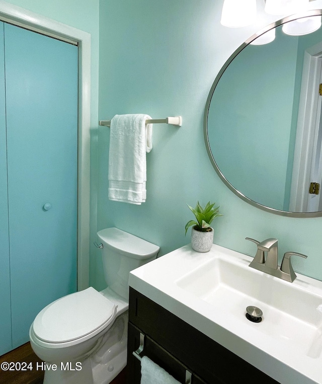 bathroom featuring vanity and toilet