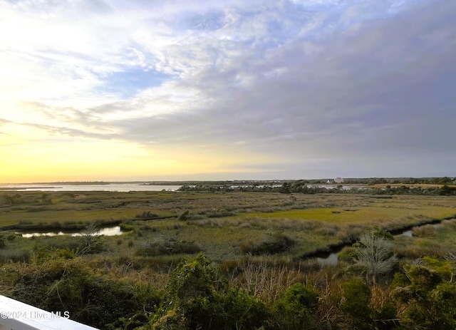 nature at dusk featuring a water view