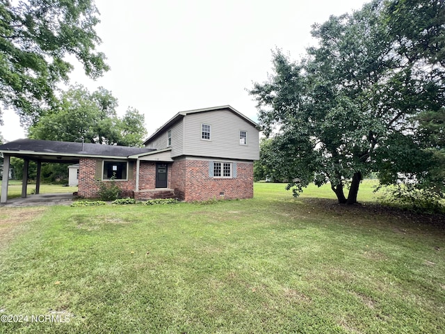 205 E Pinewood St, Roseboro, NC 28382 - view of front facade with an attached carport, a front yard, brick siding, and crawl space