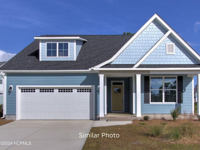 craftsman inspired home featuring covered porch