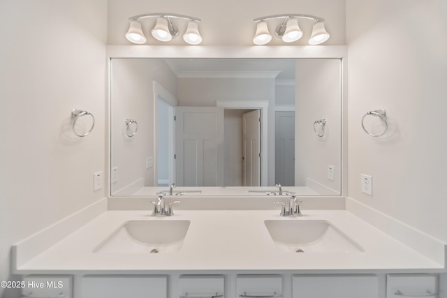 full bathroom featuring double vanity, crown molding, and a sink