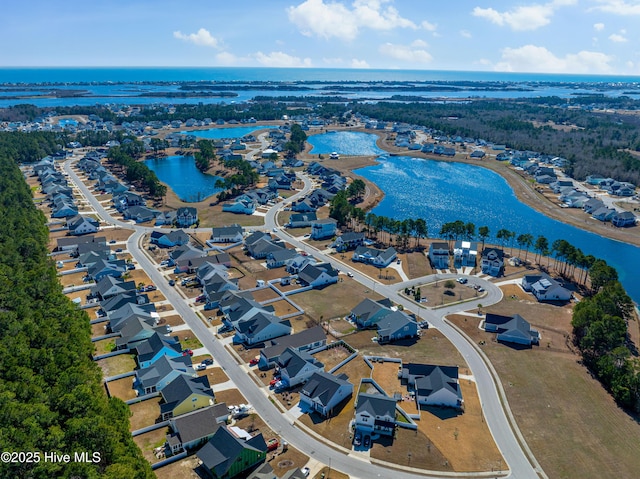 bird's eye view with a water view and a residential view