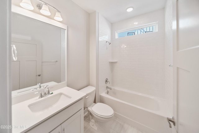 bathroom featuring shower / bathtub combination, vanity, and toilet