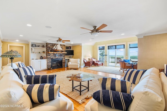 1324 Harbour Watch SW, Calabash, NC 28467 - living room featuring light wood-type flooring, ceiling fan, crown molding, a fireplace, and recessed lighting