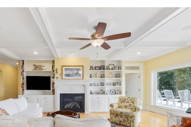 1324 Harbour Watch SW, Calabash, NC 28467 - living area with ornamental molding, beam ceiling, light wood-style flooring, a glass covered fireplace, and ceiling fan
