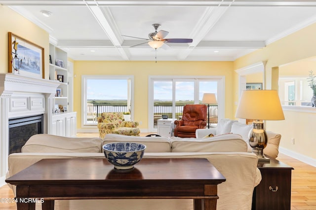 1324 Harbour Watch SW, Calabash, NC 28467 - living area with wood finished floors, ceiling fan, beamed ceiling, baseboards, and a fireplace