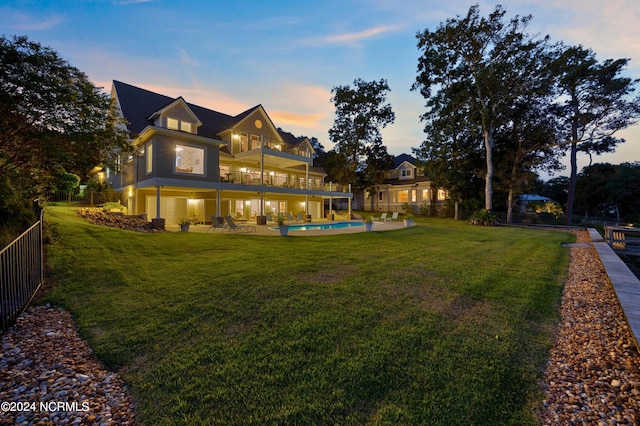1324 Harbour Watch SW, Calabash, NC 28467 - rear view of house with a balcony, an outdoor pool, and a patio