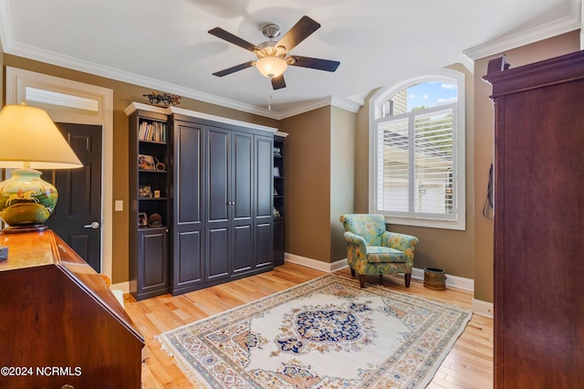 1324 Harbour Watch SW, Calabash, NC 28467 - living area featuring light wood finished floors, ceiling fan, ornamental molding, and baseboards