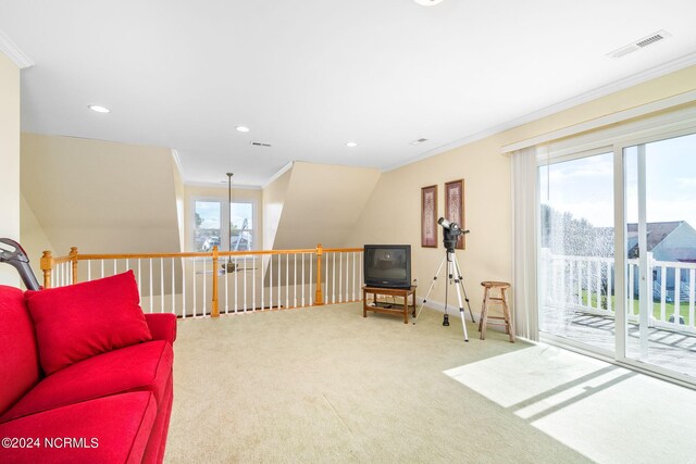 living area featuring carpet flooring, ornamental molding, and plenty of natural light