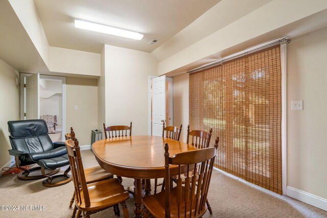 view of carpeted dining area