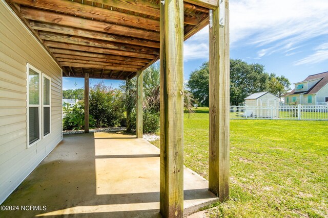 exterior space featuring a patio area and a shed