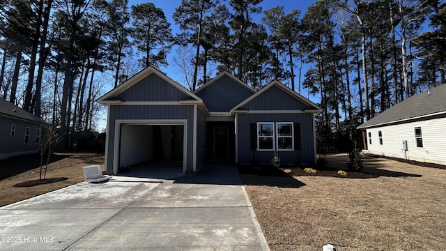 view of front of home featuring board and batten siding, concrete driveway, and an attached garage