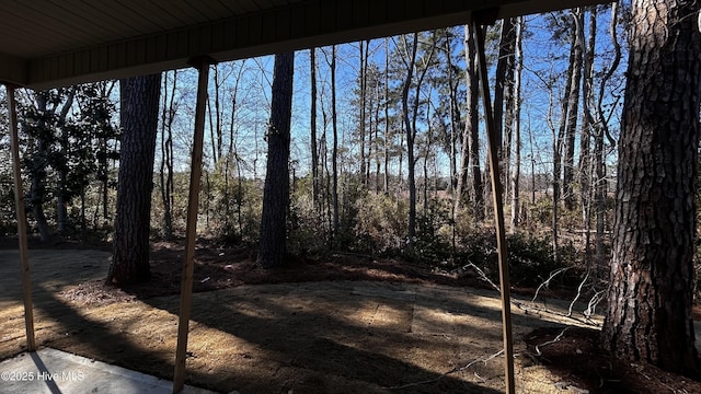 view of yard featuring a view of trees