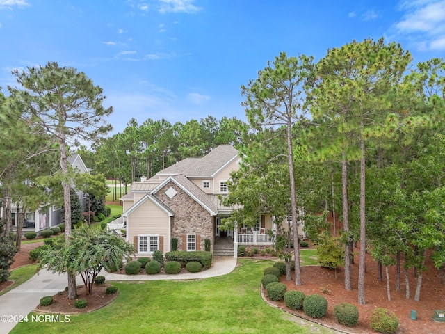 view of front of house featuring a front yard and a porch