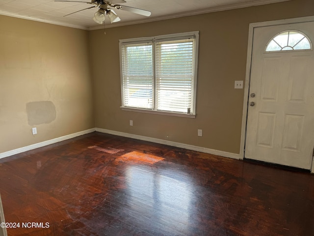 foyer with ceiling fan, crown molding, and dark hardwood / wood-style floors