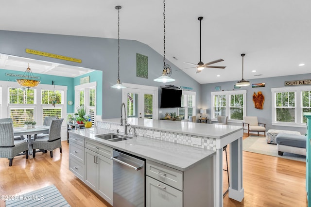 910 Old Dow Rd, Carolina Beach, NC 28428 - kitchen with dishwasher, open floor plan, a sink, ceiling fan, and high vaulted ceiling