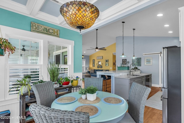 910 Old Dow Rd, Carolina Beach, NC 28428 - dining room with a ceiling fan, light wood finished floors, and vaulted ceiling