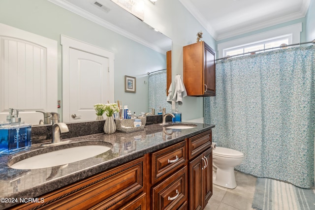 bathroom featuring tile patterned flooring, vanity, ornamental molding, and toilet