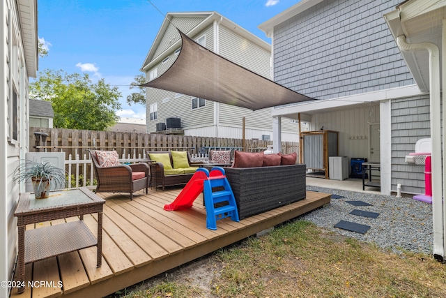 wooden terrace featuring outdoor lounge area