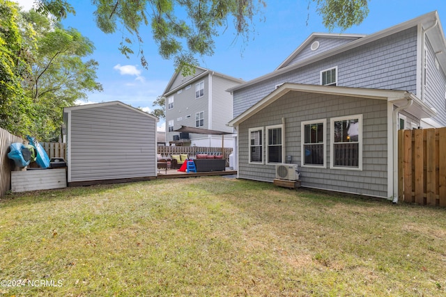 rear view of property with an outdoor hangout area and a yard