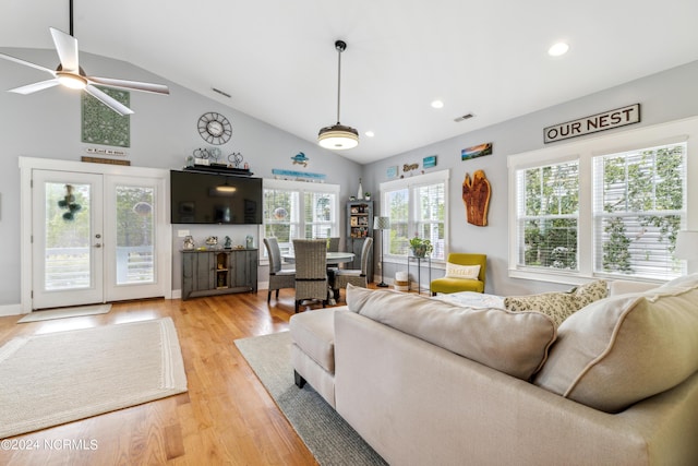 living room featuring ceiling fan, french doors, wood-type flooring, and lofted ceiling