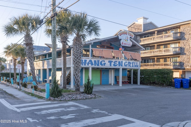 910 Old Dow Rd, Carolina Beach, NC 28428 - view of building exterior featuring a garage and driveway