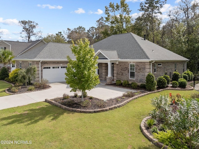 view of front of house featuring a garage and a front lawn