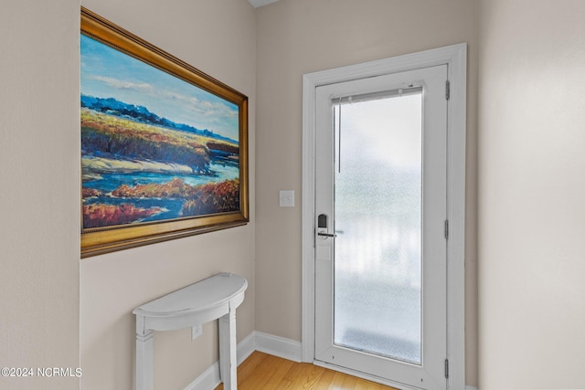 entryway with light hardwood / wood-style floors