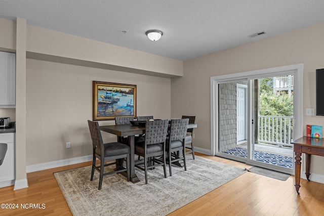 dining room featuring light wood-type flooring