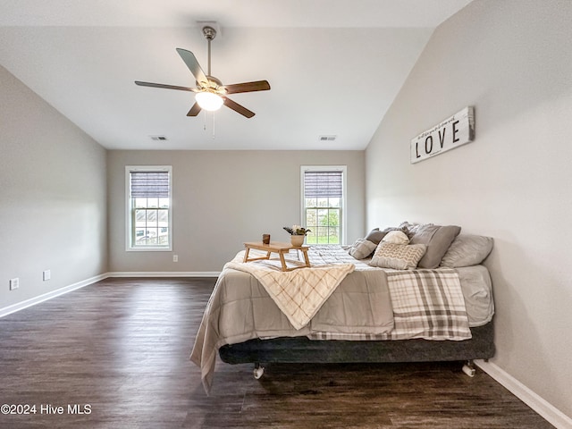 bedroom with dark wood-type flooring, ceiling fan, lofted ceiling, and multiple windows