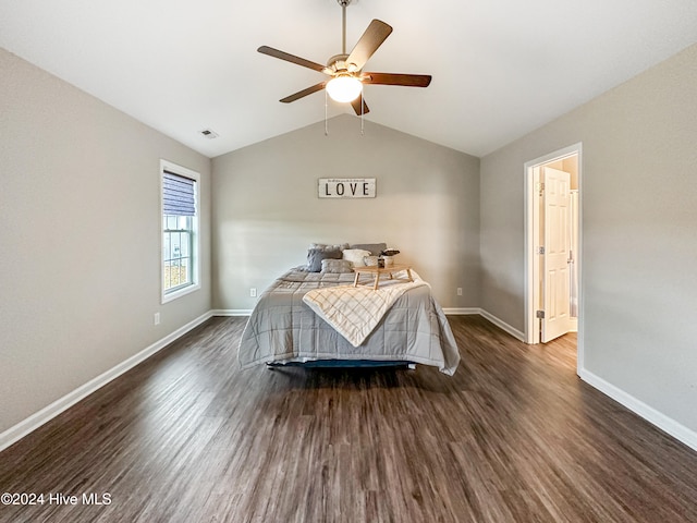 bedroom featuring vaulted ceiling, dark hardwood / wood-style flooring, and ceiling fan