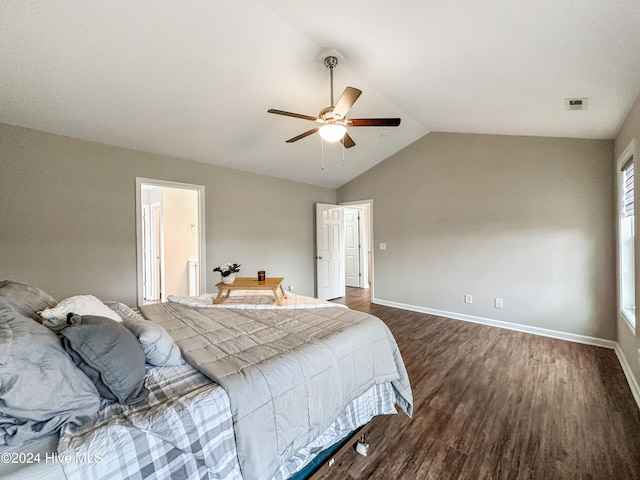 bedroom with dark wood-type flooring, vaulted ceiling, and ceiling fan