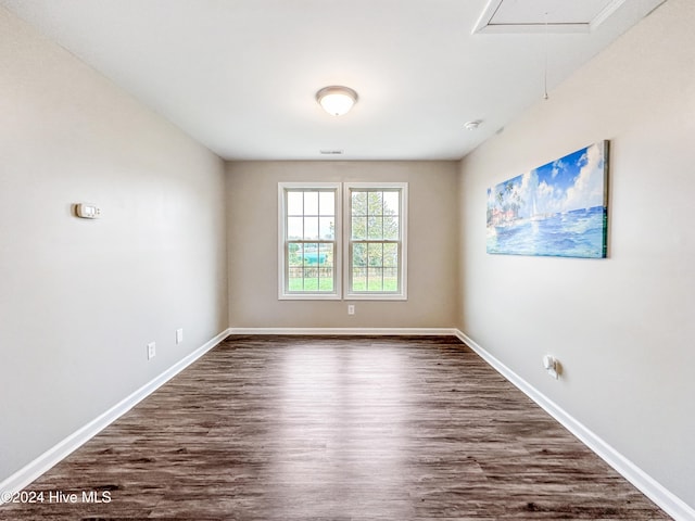 empty room featuring dark hardwood / wood-style floors