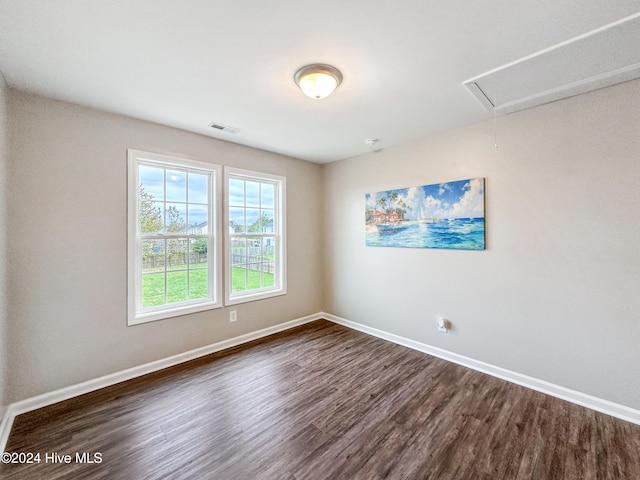 empty room with dark hardwood / wood-style floors