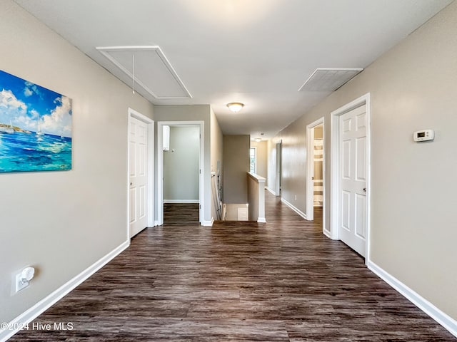 hallway with dark hardwood / wood-style floors