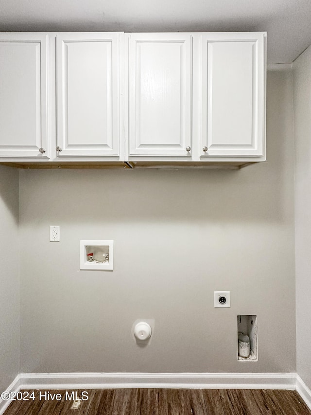 laundry room featuring cabinets, hookup for an electric dryer, dark hardwood / wood-style floors, and washer hookup