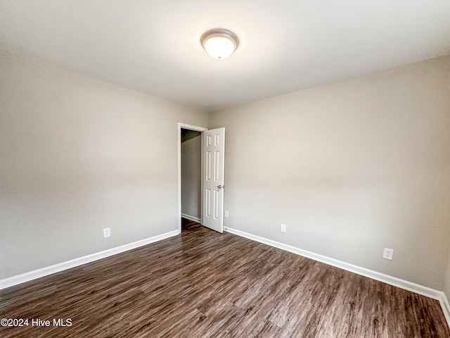 empty room featuring dark hardwood / wood-style floors