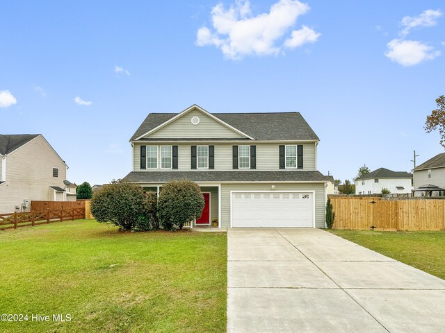 front facade with a front yard and a garage