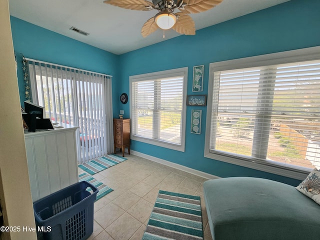 sitting room featuring light tile patterned floors and ceiling fan