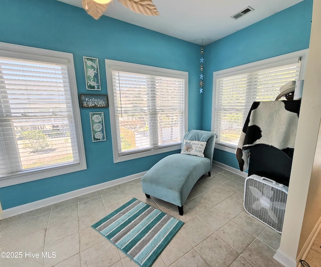 living area with tile patterned flooring