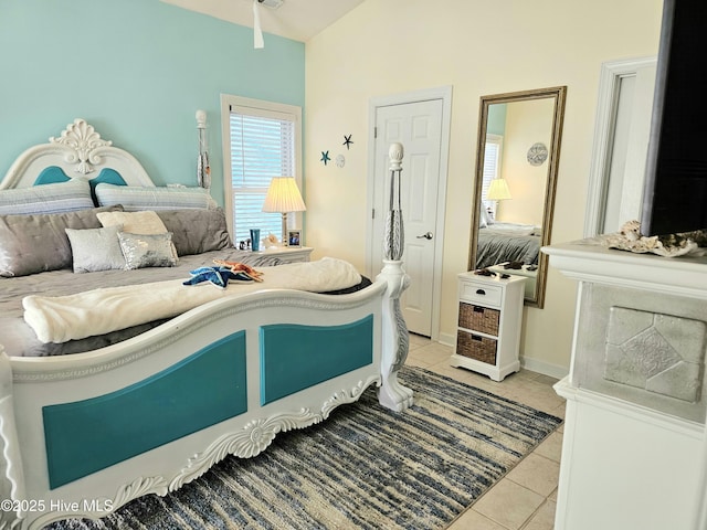 bedroom with light tile patterned floors