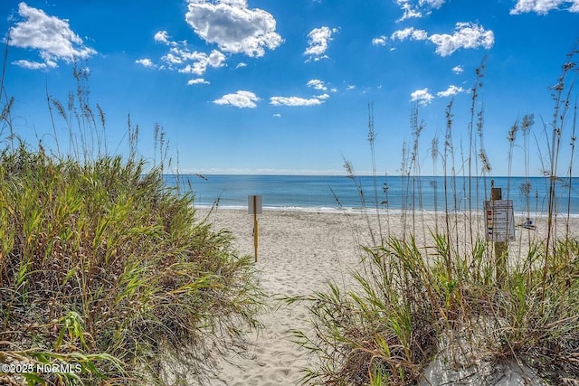 property view of water featuring a beach view