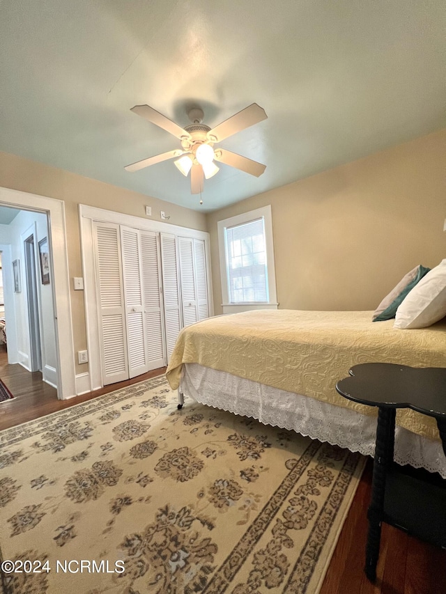 bedroom featuring ceiling fan and dark hardwood / wood-style flooring