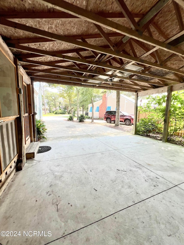 garage featuring a carport