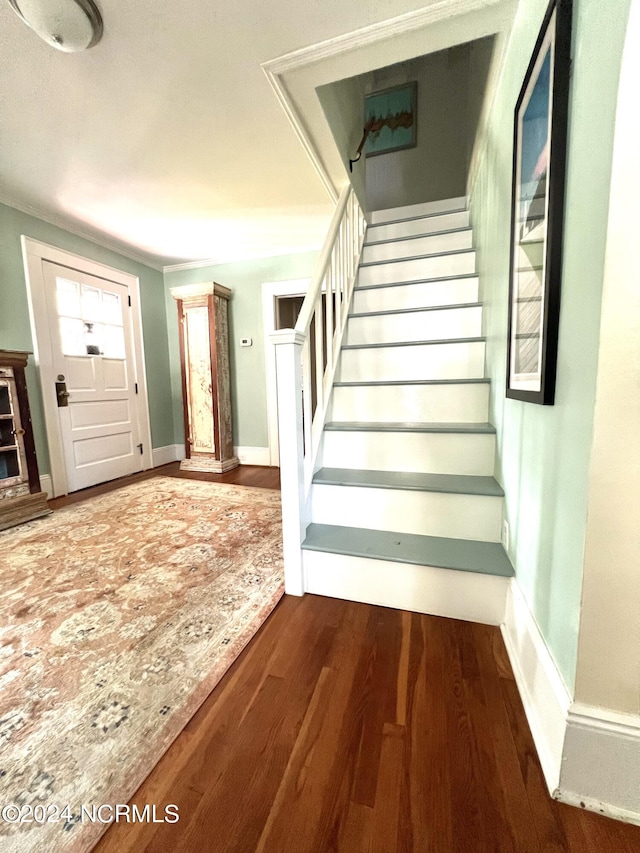 staircase featuring hardwood / wood-style floors