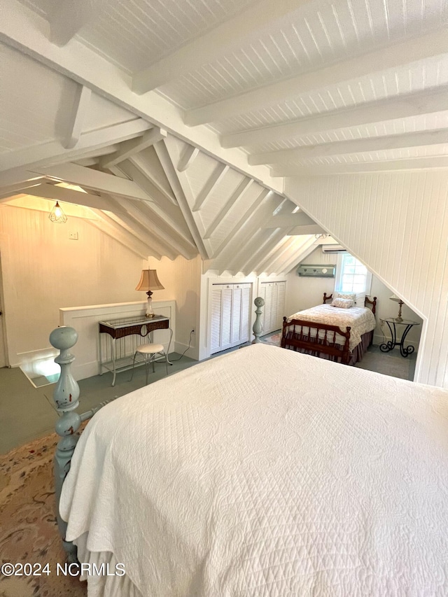 bedroom with vaulted ceiling with beams