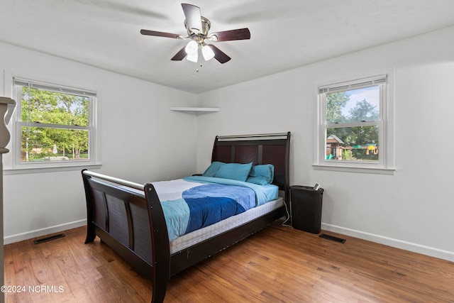 bedroom featuring hardwood / wood-style floors and ceiling fan