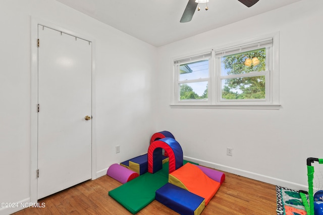 game room with ceiling fan and hardwood / wood-style floors