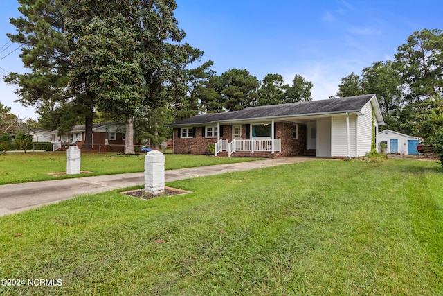 single story home with a front lawn and covered porch